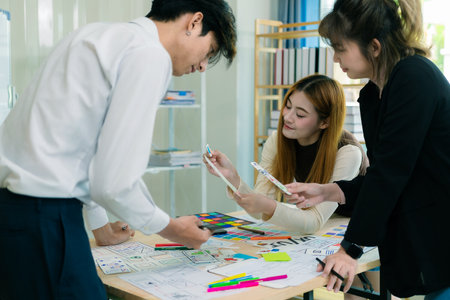 Application development UI UX web designer team is working together to develop a mobile responsive...