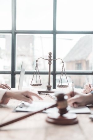 Lawyer giving legal advice to couples regarding purchasing a rental home. Financial advisor with investment contract, mortgage loan, real estateの写真素材