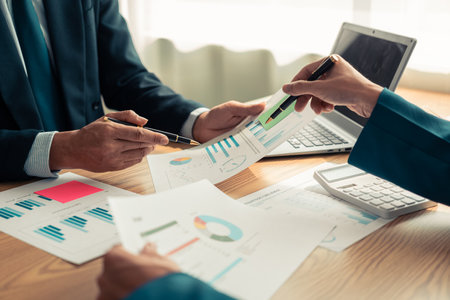Group of business people discussing charts and graphs showing the results of successful teamwork in the office. Project planning presentation  Sustainable development goal conceptの写真素材