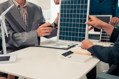 Business people of various ages in formal suits working together in meeting, discussing, planning...