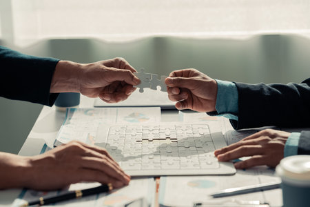 Business people discussing charts and graphs showing the results of successful teamwork on charts and graphs showing the growth of investment results of teamwork. Close up.の写真素材