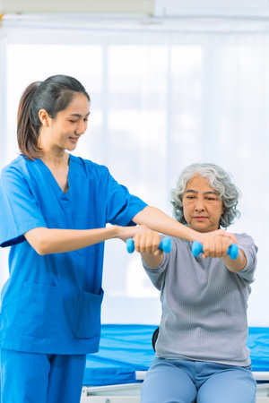 Elderly woman receives medical services from home care nurse while performing muscle strengthening...
