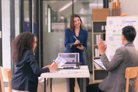 Group of business people discussing charts and graphs showing results of teamwork, analyzing...