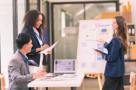 Group of business people discussing charts and graphs showing results of teamwork, analyzing...