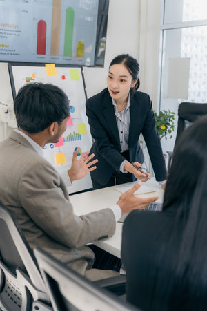 Entrepreneur in suit brainstorming about marketing strategy in company conference room....
