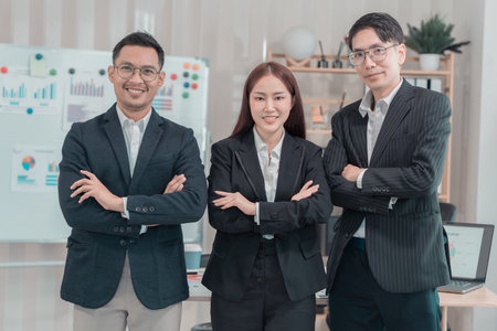 Group of creative young Asian business people expressing joyful excitement with success, teamwork, celebration of success.の写真素材