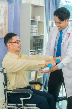 Physical therapy with dumbbells and elderly man with nurse for rehabilitation, support and retirement, health care, medical assistanceの写真素材