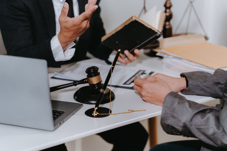 A notary or notary working with contract documents in a courtroom, meeting with clients, and discussing real estate contract documents.の写真素材