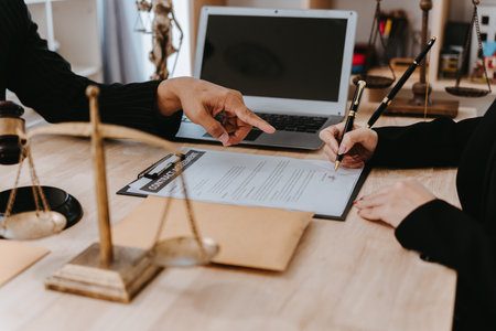 A notary or notary working with contract documents in a courtroom, meeting with clients, and...