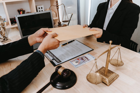 Officials receive money in a legal or business context. Close-up.の写真素材