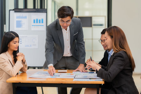 Group of business people discussing business plan in office conference room. Project planning,...