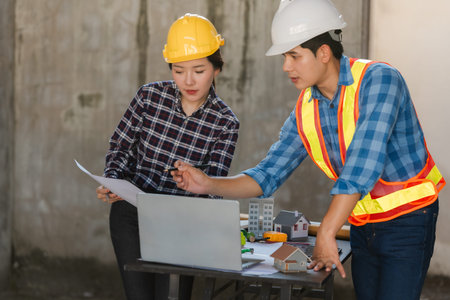 Engineering and architectural concepts: Asian female architects and engineers are discussing...