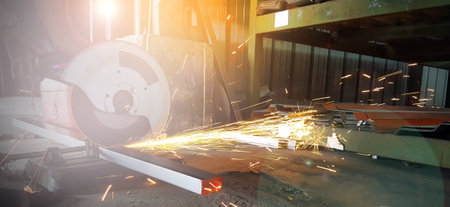 Sparks from the metal cutting works in a factory.