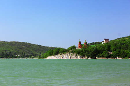 Church on other bank of lakeの写真素材