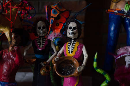 The photograph shows some handmade dolls for the Day of the Dead holiday in Mexico