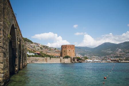 Castle walls, Red Tower and Shipyard on Mediterranean sea coast.のeditorial素材