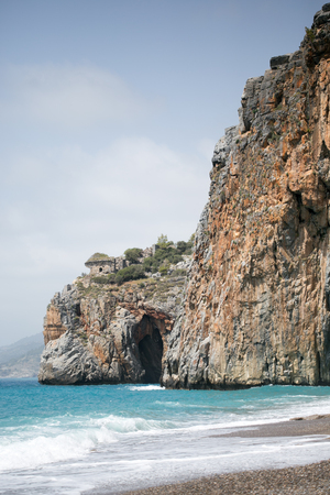 Mediterranean beach with turquoise sea and rocks on shore in Kizilim beach of Gazipasha town in Mediterranean Turkey shot on sunny dayの写真素材