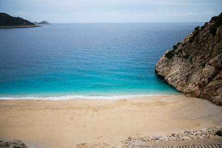 Beautiful small and picturesque Kaputash beach in Antalya province of Turkey view from above with turquoise sea and rocksの写真素材