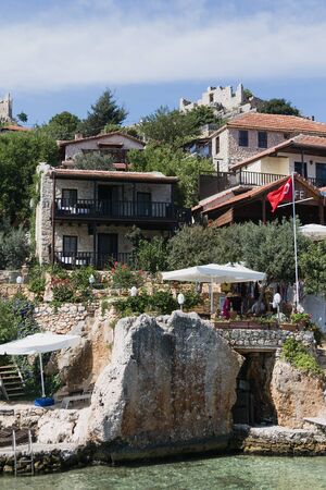 SIMENA, TURKEY - MAY 20 : kalekoy Simena settlement in Uchagiz bay of Turkey near sunken city of Kekova with stonebuilt houses mixed with ancient ruins 2016のeditorial素材