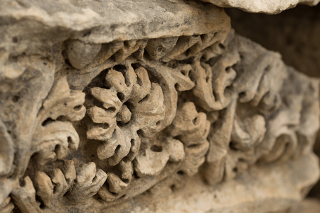 carved stonework in ancient town. Shot with shallow depth of field.の写真素材