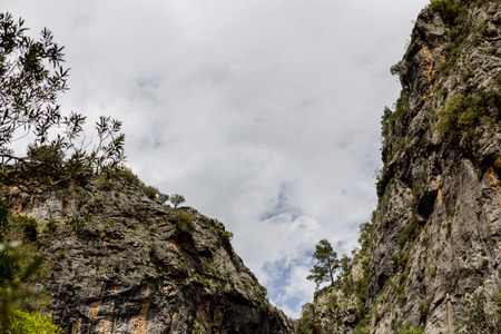 Horizontal mountain landscape with cloudy sky and copy space.の写真素材