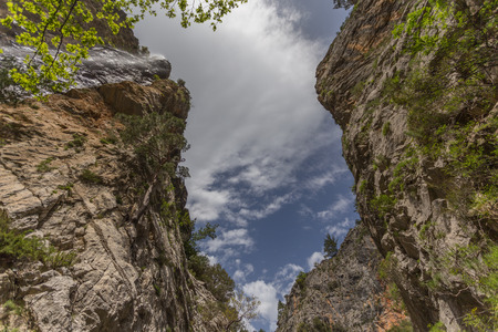 Horizontal mountain landscape with cloudy sky and copy space.の写真素材