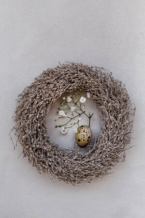Easter concept. Quail egg and gypsophila in a nest over light gray backgroundの写真素材