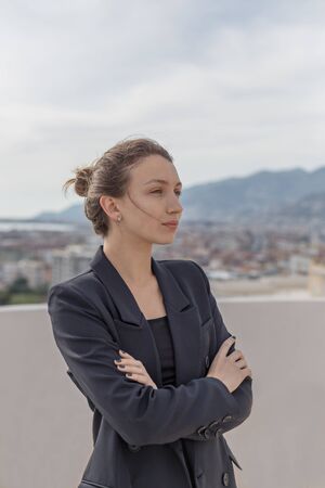 Self-confident business woman wearing elegant black suitの写真素材