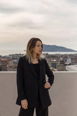 Self-confident business woman wearing elegant black suitの写真素材