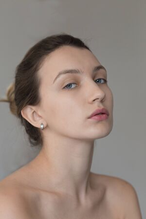 Beauty portrait of young female with glowing skinの写真素材