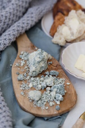 Turkish blue lamb cheese served on a wooden cheeseplateの写真素材