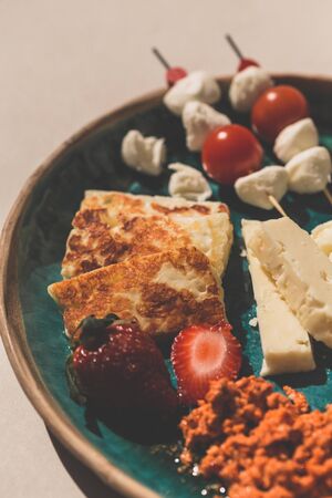 Mediterranean cheese platter with hellim and other cheese servedの写真素材