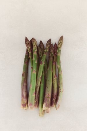 topview shot of asparagus on light gray backgroundの写真素材