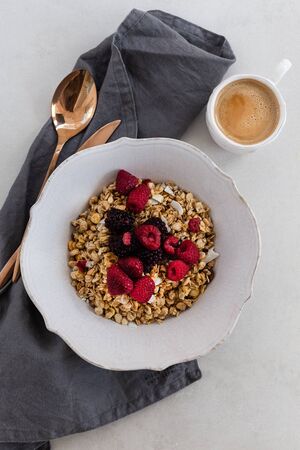 Healthy and nutritious breakfast. Granola with berries in a rustic bowl.の写真素材