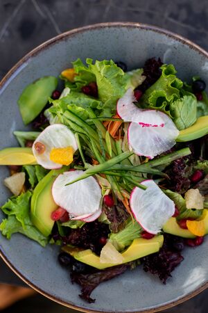 Topview image of vegetable salad with turnips and avocadoの写真素材