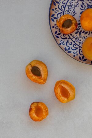 Topview image of apricots on light gray tabletopの写真素材
