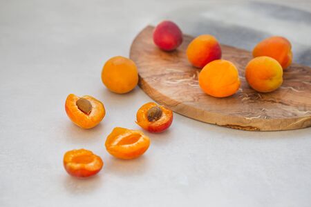 Apricots on light gray tabletopの写真素材