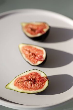 Figs on white ceramic plate.の写真素材