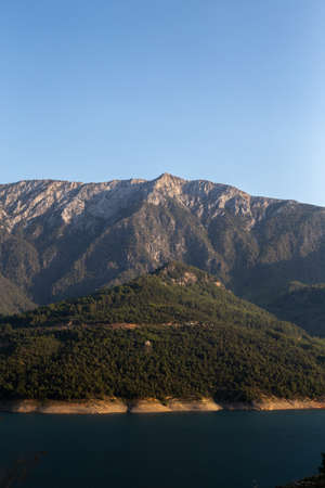 Vertical mountain landscape with blue sky. Negative space.の写真素材
