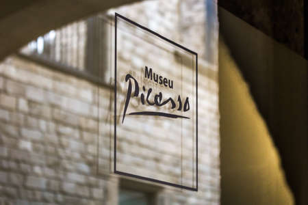 Logo of Picasso museum on a door at the entrance of the museum. Barcelona, Spain. Copy space...