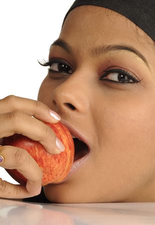 Young girl eating appleの写真素材