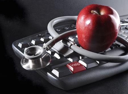 Apple and stethoscope on keyboard with HELP key