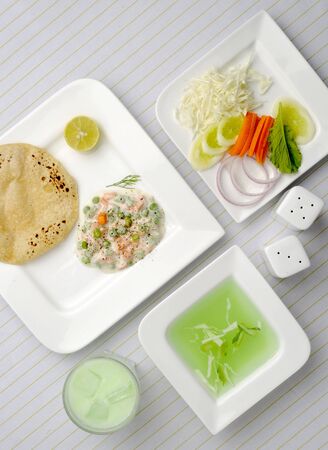 Indian Food in white platesの写真素材