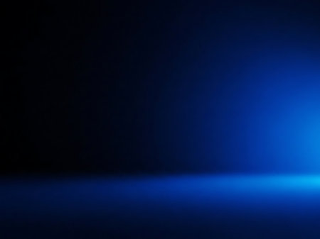 A dark blue gradient background illuminated by a subtle light source This image provides a clean and modern backdrop suitable for a variety of applications The gradient effect creates a sense of depth while the light source adds visual interest and highlights textures This versatile background can be used for graphic design web development and photography projectsの素材
