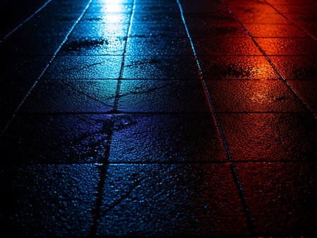 This evocative image captures the essence of a wet city street at night The pavement glistens with moisture reflecting the vibrant city lights in a captivating display of color The interplay of cool blue and warm red tones creates a dynamic and moody atmosphere inviting the viewer to immerse themselves in the sceneの素材