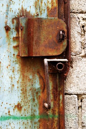 Old rusty lock on the garage doorの写真素材