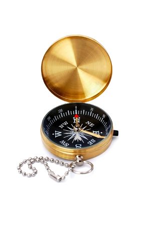 Golden compass isolated on whiteの写真素材