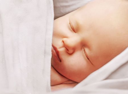 Newborn sleeping in the slingの写真素材