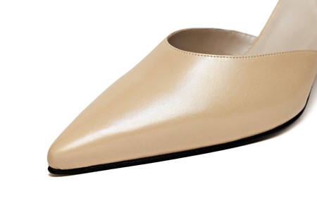 Close up of yellow woman shoe isolated on whiteの写真素材