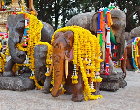 Group of elephant statues decorated with flowersの写真素材